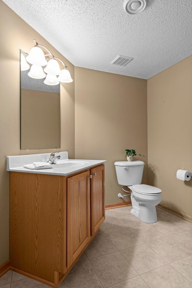 10931 185th Cir NW, Elk River, MN 55330 - half bathroom with vanity, tile patterned flooring, and a textured ceiling