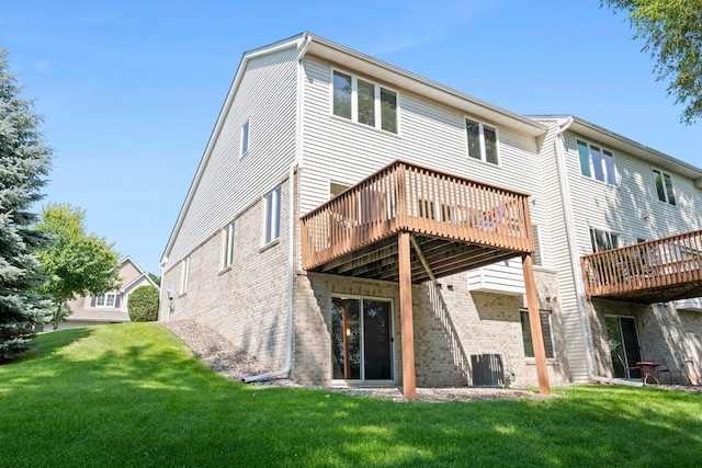 10931 185th Cir NW, Elk River, MN 55330 - rear view of house featuring brick siding, a yard, and a deck