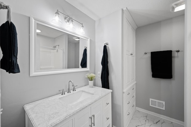 509 2nd St S, Montrose, MN 55363 - bathroom with vanity, marble finish floors, and a shower