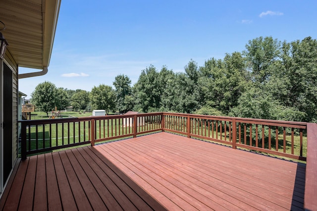 509 2nd St S, Montrose, MN 55363 - deck with a lawn and a storage shed