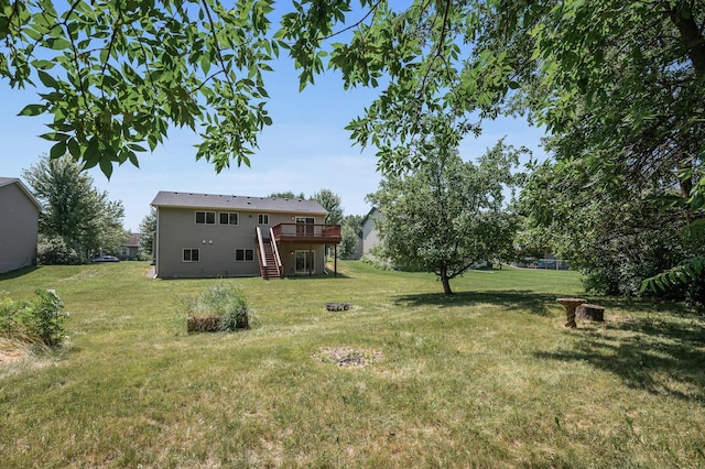 509 2nd St S, Montrose, MN 55363 - view of grassy yard with a deck, stairway, and a fire pit