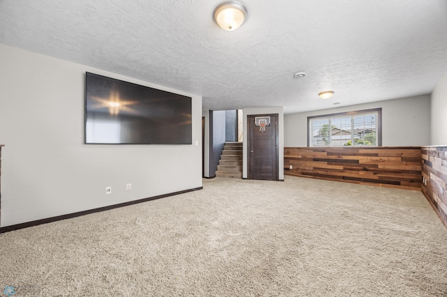 4416 10th St W, Fargo, ND 58078 - carpeted empty room with stairway and a textured ceiling
