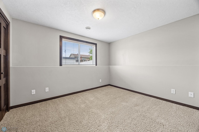 4416 10th St W, Fargo, ND 58078 - empty room with a textured ceiling and carpet floors