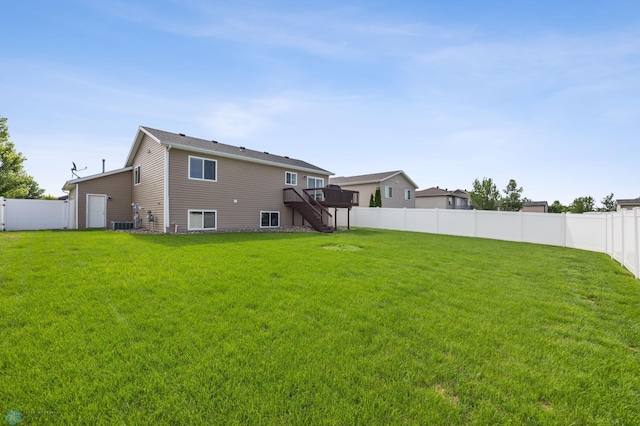 4416 10th St W, Fargo, ND 58078 - back of house featuring stairway, a wooden deck, and a fenced backyard