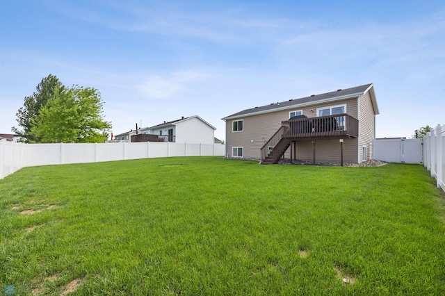 4416 10th St W, Fargo, ND 58078 - back of property featuring stairs, a wooden deck, and a fenced backyard