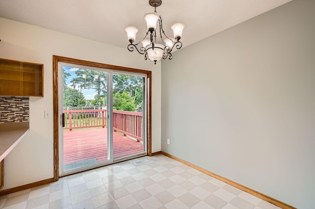 2208 84th Ave N, Brooklyn Park, MN 55444 - unfurnished dining area with a chandelier and light flooring