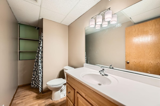 2208 84th Ave N, Brooklyn Park, MN 55444 - bathroom with a drop ceiling, wood finished floors, vanity, and a shower with shower curtain