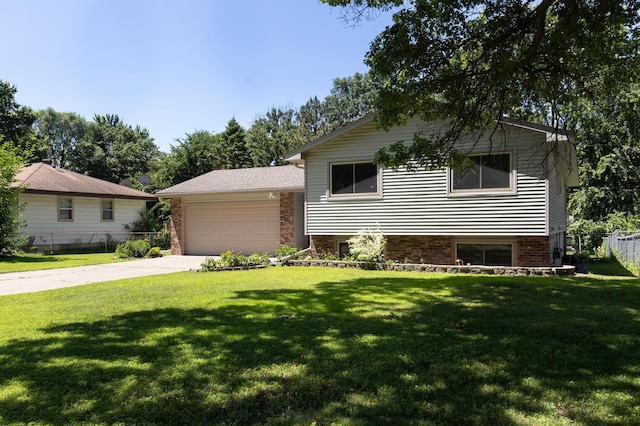 5833 Perry Ave N, Crystal, MN 55429 - split level home featuring an attached garage, concrete driveway, and brick siding