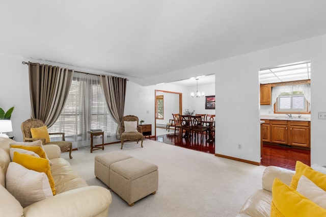 5833 Perry Ave N, Crystal, MN 55429 - living room with a chandelier and dark carpet