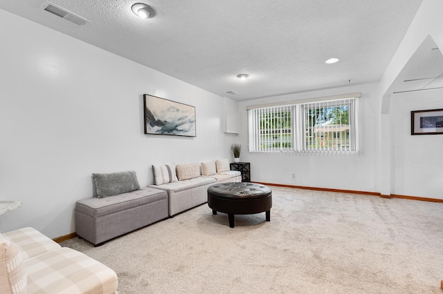 5833 Perry Ave N, Crystal, MN 55429 - carpeted living room with a textured ceiling and baseboards