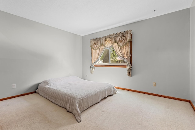 5833 Perry Ave N, Crystal, MN 55429 - carpeted bedroom with baseboards