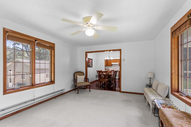 5833 Perry Ave N, Crystal, MN 55429 - sitting room featuring baseboard heating, carpet flooring, and plenty of natural light