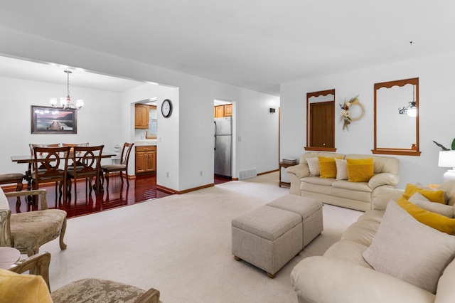 5833 Perry Ave N, Crystal, MN 55429 - living room featuring light colored carpet and a chandelier