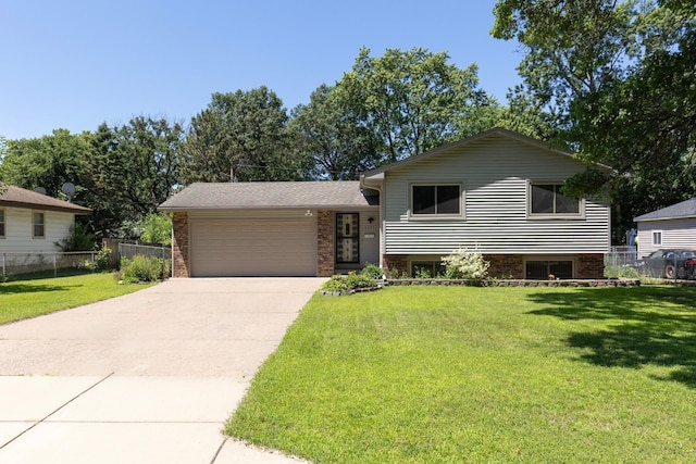 5833 Perry Ave N, Crystal, MN 55429 - split level home with driveway, an attached garage, and brick siding