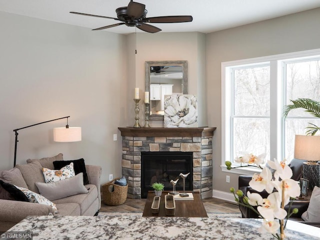 0000 Central Dr NE, Cambridge, MN 55008 - living area with ceiling fan, wood finished floors, and a fireplace