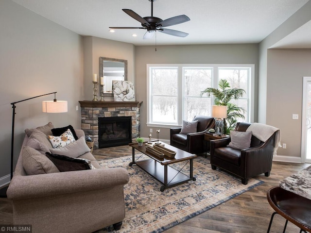 0000 Central Dr NE, Cambridge, MN 55008 - living area with wood finished floors, ceiling fan, a stone fireplace, and recessed lighting