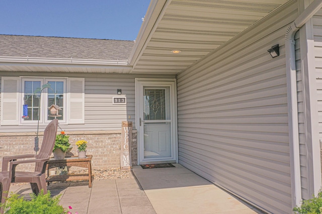 913 Anderson Way, Alexandria, MN 56308 - view of exterior entry with brick siding and roof with shingles