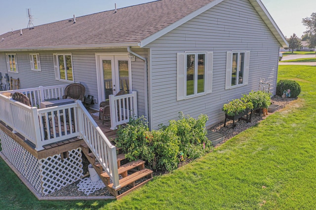913 Anderson Way, Alexandria, MN 56308 - rear view of property featuring a deck, a lawn, roof with shingles, and french doors