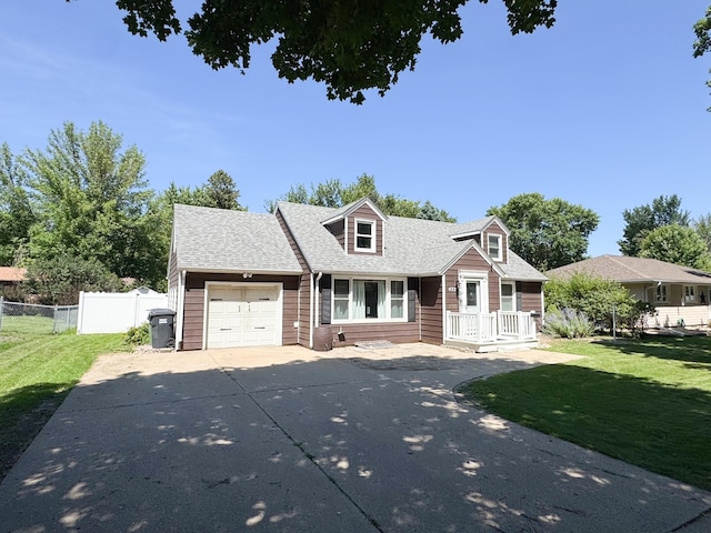 422 Galena St, Worthington, MN 56187 - cape cod house with a garage, driveway, and a shingled roof