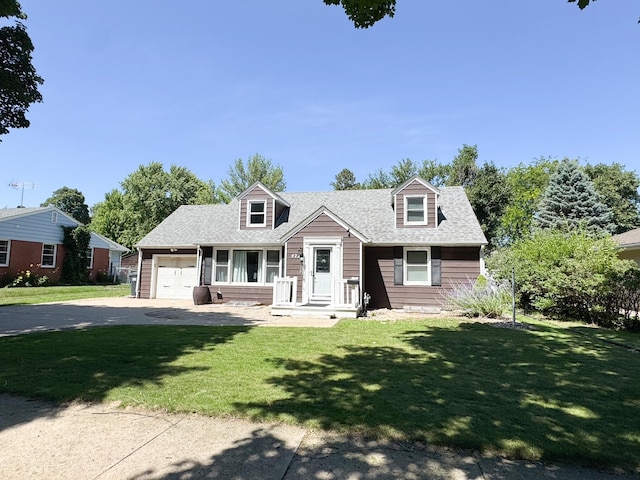 422 Galena St, Worthington, MN 56187 - new england style home featuring concrete driveway, a garage, and a front yard