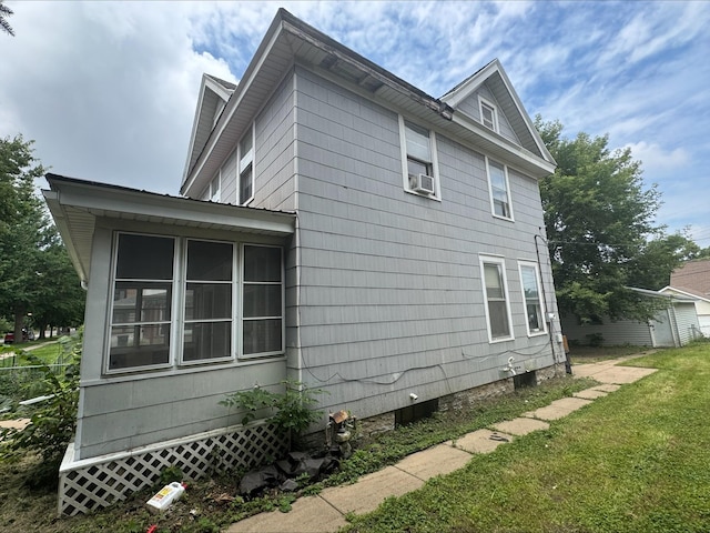 1051 Mclean Ave, Saint Paul, MN 55106 - view of side of home featuring cooling unit and a sunroom