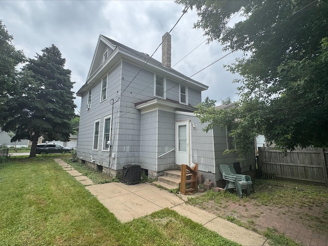 1051 Mclean Ave, Saint Paul, MN 55106 - back of property featuring a chimney