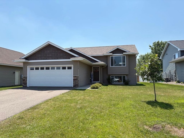 1374 Blue Jay Pl, New Richmond, WI 54017 - view of front facade with driveway, a garage, a front lawn, and roof with shingles
