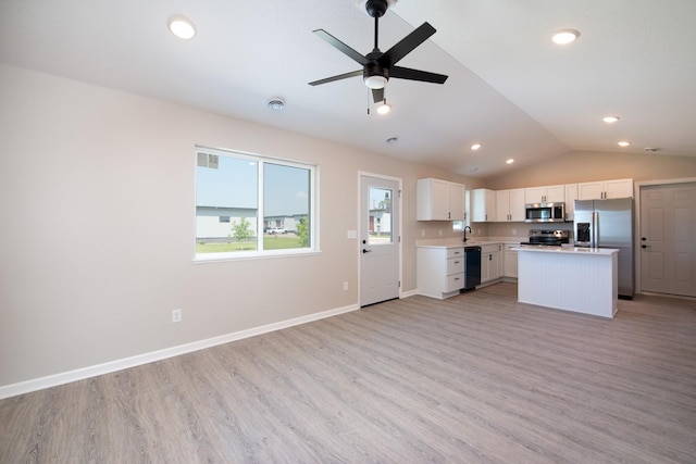 3101 Scotch Ln, Mankato, MN 56001 - kitchen with appliances with stainless steel finishes, open floor plan, light countertops, light wood-style flooring, and lofted ceiling