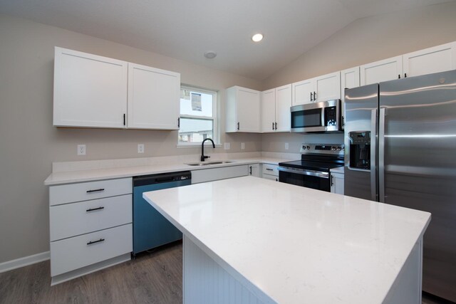 3101 Scotch Ln, Mankato, MN 56001 - kitchen with stainless steel appliances, dark wood-style floors, lofted ceiling, white cabinetry, and light countertops