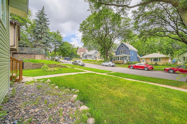 1076 Wilson Ave, Saint Paul, MN 55106 - view of green lawn featuring a residential view