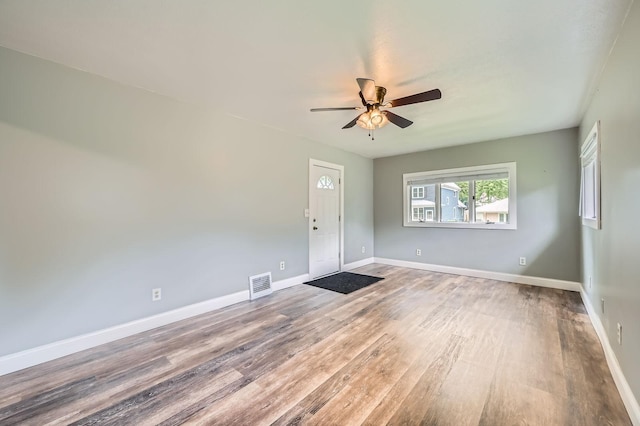 1076 Wilson Ave, Saint Paul, MN 55106 - empty room with a ceiling fan and wood finished floors