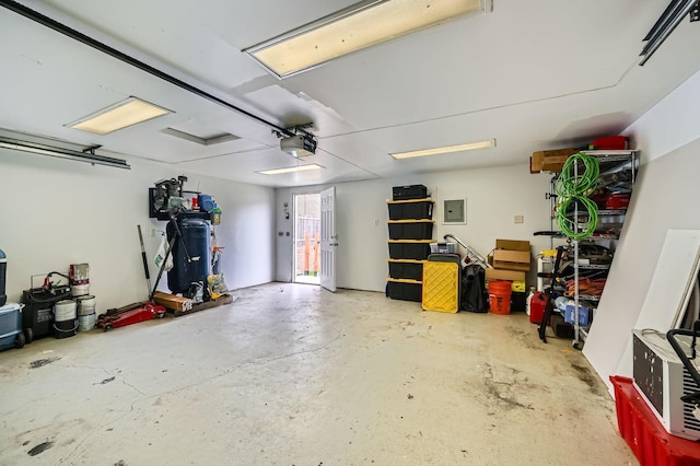 1076 Wilson Ave, Saint Paul, MN 55106 - garage with a garage door opener and electric panel