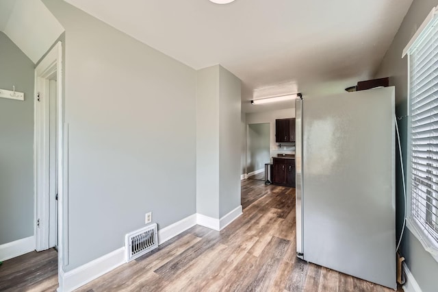1076 Wilson Ave, Saint Paul, MN 55106 - spare room with wood finished floors and baseboards