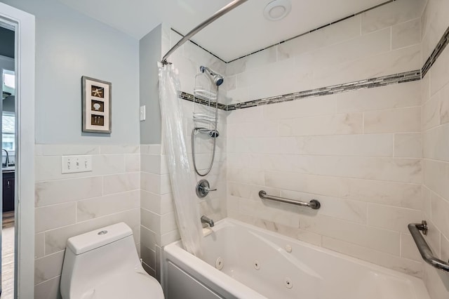 1076 Wilson Ave, Saint Paul, MN 55106 - bathroom featuring tile walls, a combined bath / shower with jetted tub, and wainscoting