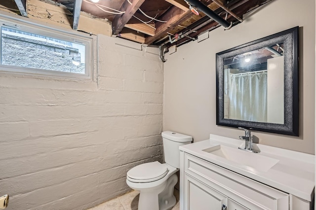 1076 Wilson Ave, Saint Paul, MN 55106 - bathroom featuring vanity, a shower with shower curtain, and tile patterned flooring