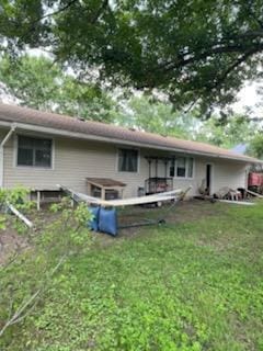 10178 Uplander St NW, Coon Rapids, MN 55433 - back of house with a lawn