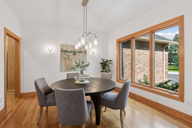 4301 Overlook Dr, Bloomington, MN 55437 - dining space featuring light wood-type flooring and a chandelier