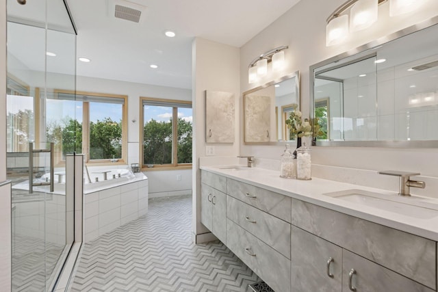 4301 Overlook Dr, Bloomington, MN 55437 - bathroom with double vanity, a garden tub, and recessed lighting