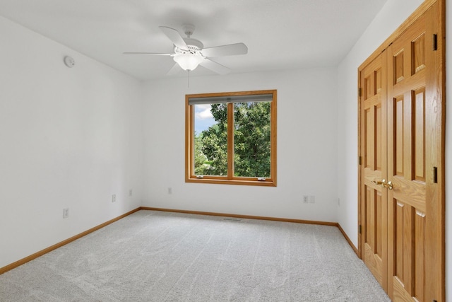 4301 Overlook Dr, Bloomington, MN 55437 - unfurnished bedroom featuring light colored carpet and a ceiling fan