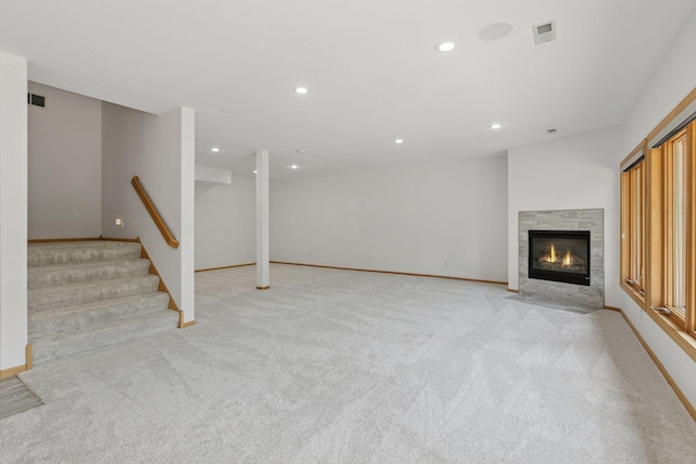 4301 Overlook Dr, Bloomington, MN 55437 - below grade area with recessed lighting, light carpet, a fireplace with flush hearth, and stairway