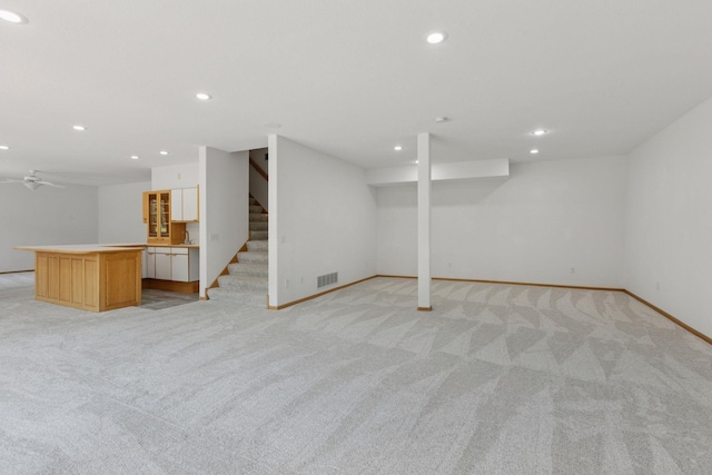 4301 Overlook Dr, Bloomington, MN 55437 - finished below grade area featuring light carpet, recessed lighting, stairs, and a ceiling fan