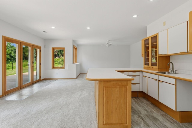 4301 Overlook Dr, Bloomington, MN 55437 - kitchen with light countertops, recessed lighting, a peninsula, white cabinets, and ceiling fan