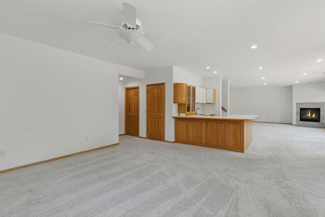 4301 Overlook Dr, Bloomington, MN 55437 - unfurnished living room with light carpet, recessed lighting, a glass covered fireplace, and ceiling fan