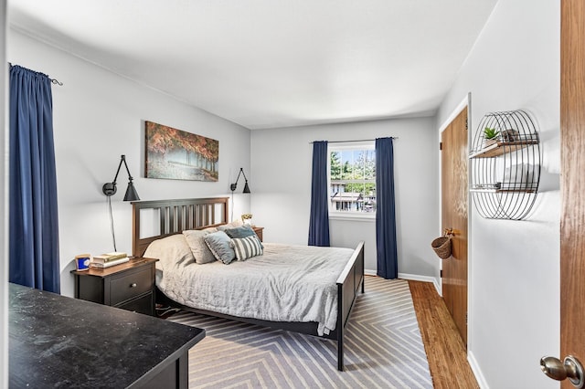 4309 78th Ave N, Brooklyn Park, MN 55443 - bedroom featuring baseboards and wood finished floors
