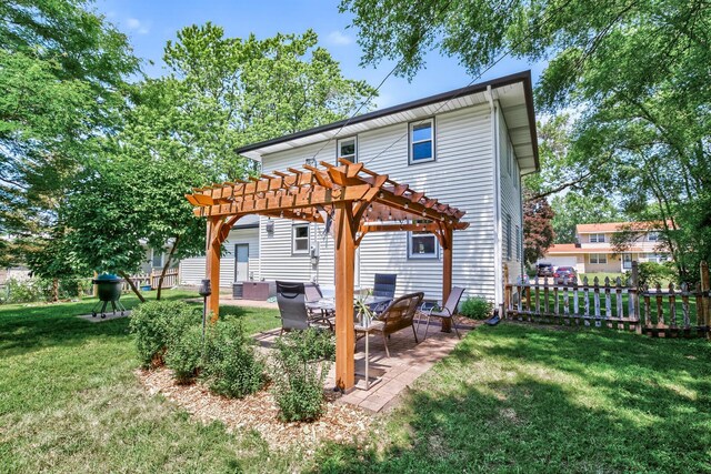 4309 78th Ave N, Brooklyn Park, MN 55443 - rear view of house with a pergola and a patio