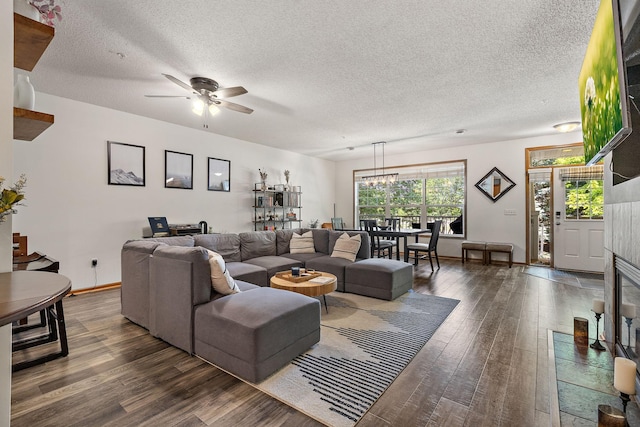4940 Underwood Ln N Unit 4940B, Plymouth, MN 55442 - living area featuring wood finished floors, a ceiling fan, a textured ceiling, and a chandelier