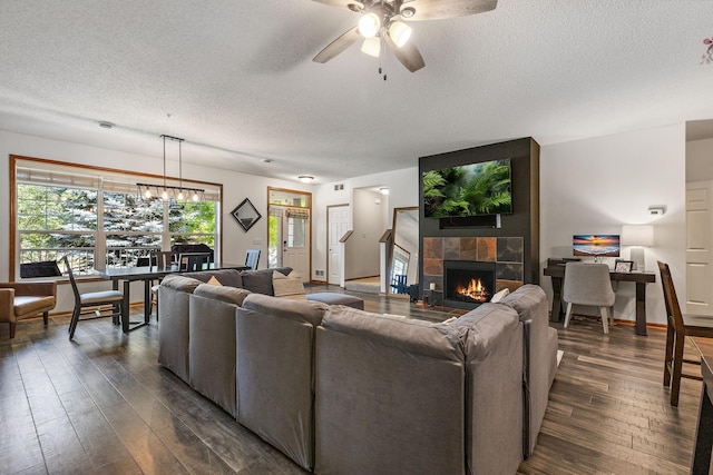 4940 Underwood Ln N Unit 4940B, Plymouth, MN 55442 - living area featuring a textured ceiling, dark wood-type flooring, a ceiling fan, and a tiled fireplace