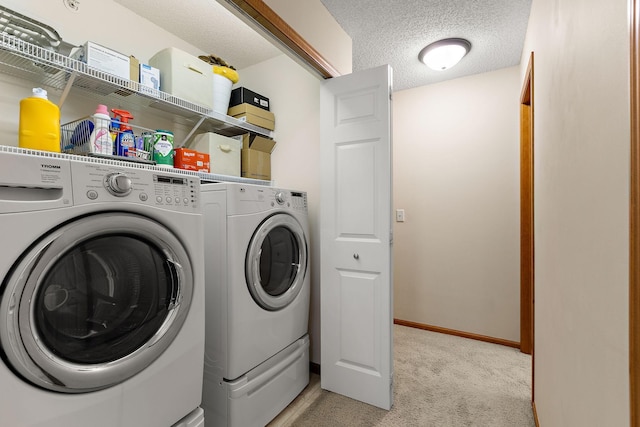 4940 Underwood Ln N Unit 4940B, Plymouth, MN 55442 - laundry room featuring washing machine and clothes dryer, light colored carpet, and a textured ceiling