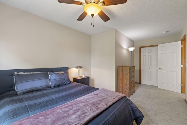 4940 Underwood Ln N Unit 4940B, Plymouth, MN 55442 - carpeted bedroom with a closet, ceiling fan, and a textured ceiling