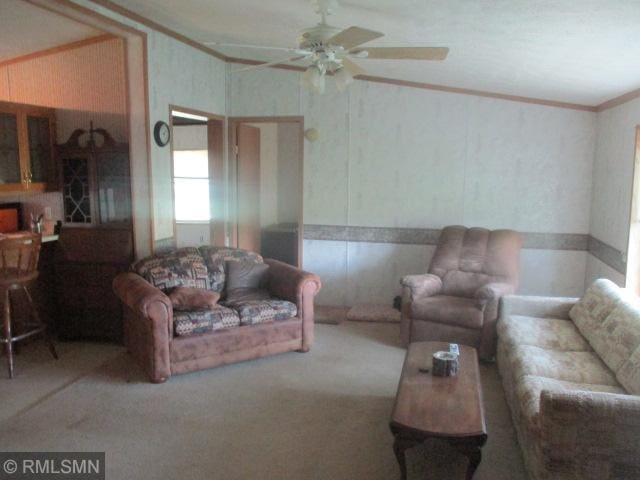 32546 360th St, Kimberly Twp, MN 56431 - carpeted living room with a ceiling fan and ornamental molding